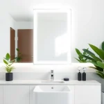 Admire the elegant led mirror reflecting a stylish modern bathroom with soothing decor.