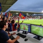 Exciting live soccer match atmosphere with Okwintv broadcasting energetic fans and commentators.